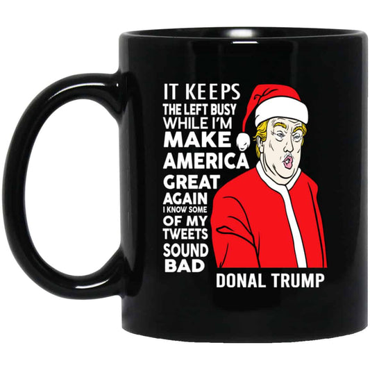 
	Donal Trump It Keeps The Left Busy While I’m Make America Great Christmas Mug